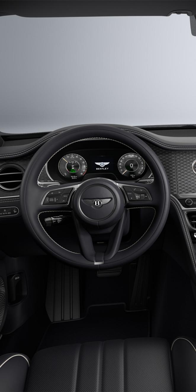 Driver’s view of the Bentley Flying Spur steering wheel and Imperial Blue interior.