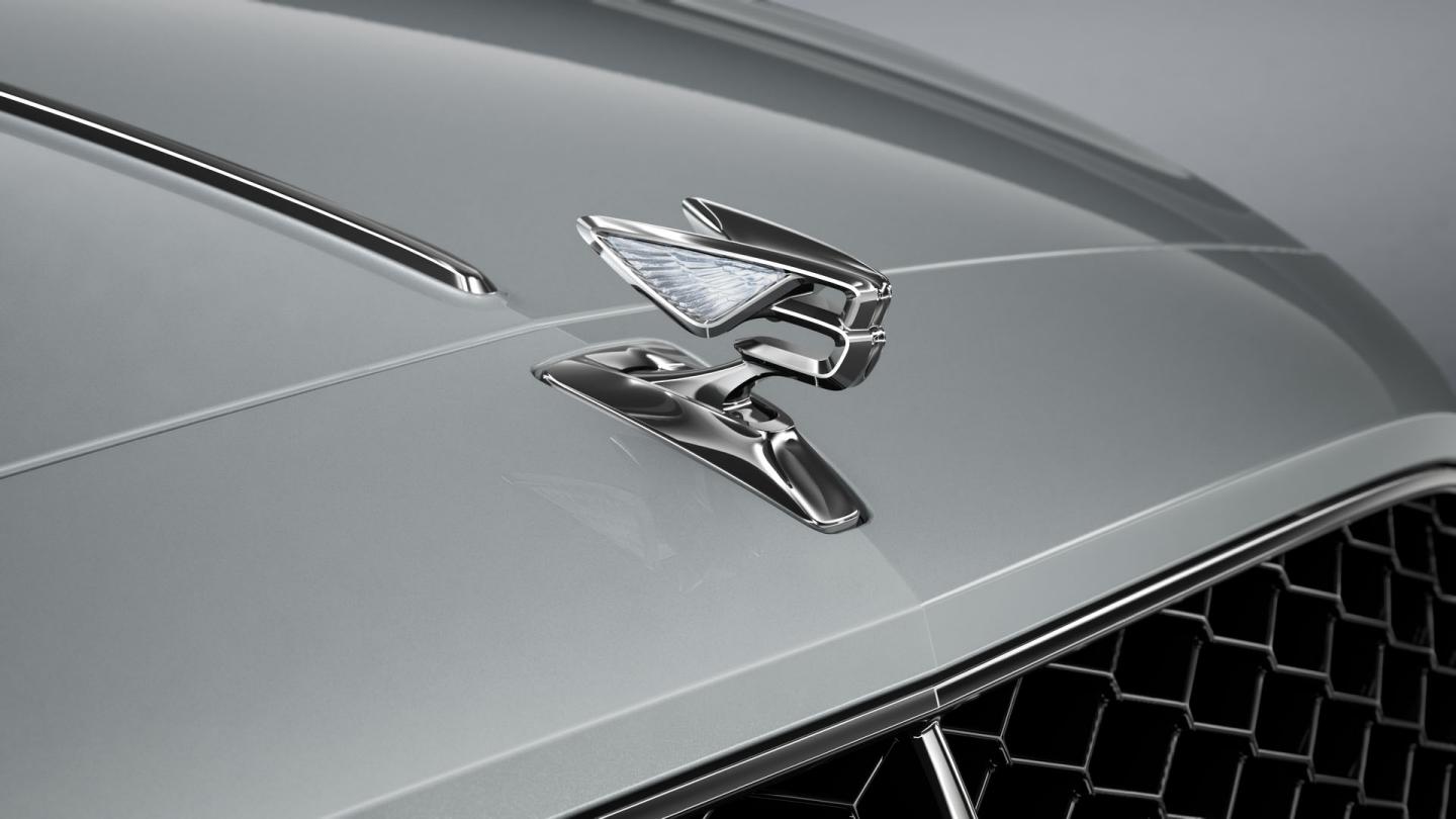 Close-up of the Flying B bonnet mascot on the Bentley Flying Spur in Moonbeam.