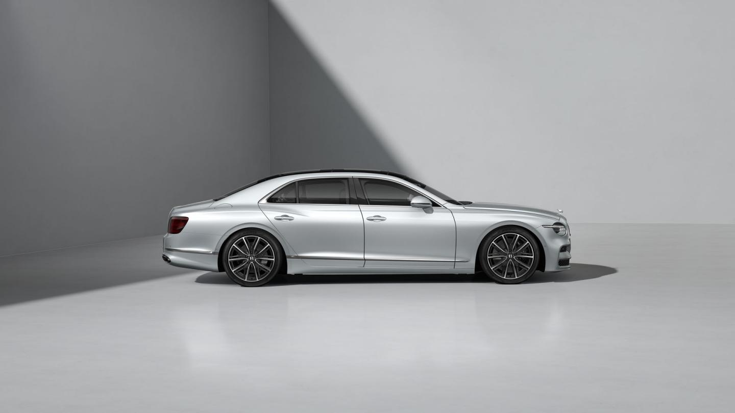 Side profile shot of the Bentley Flying Spur in Moonbeam with Bright Chrome Exterior detailing.