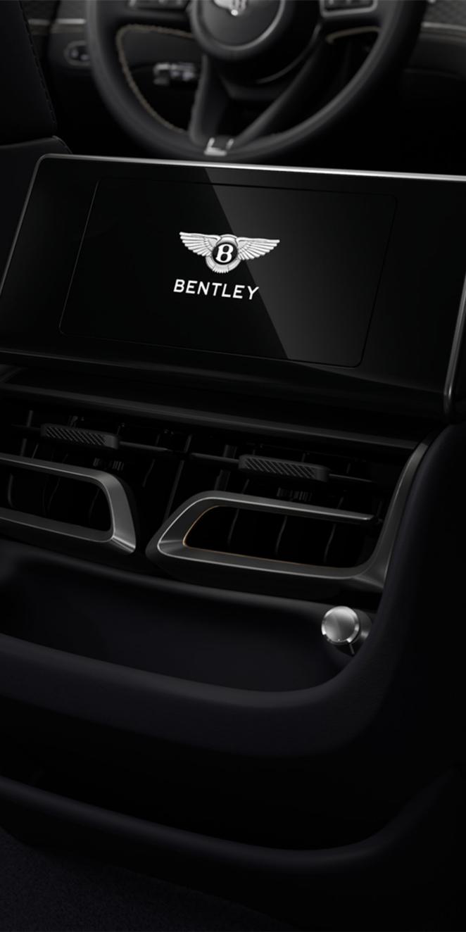 Rear passenger digital screen inside the Bentley Flying Spur with Imperial Blue cabin trim.