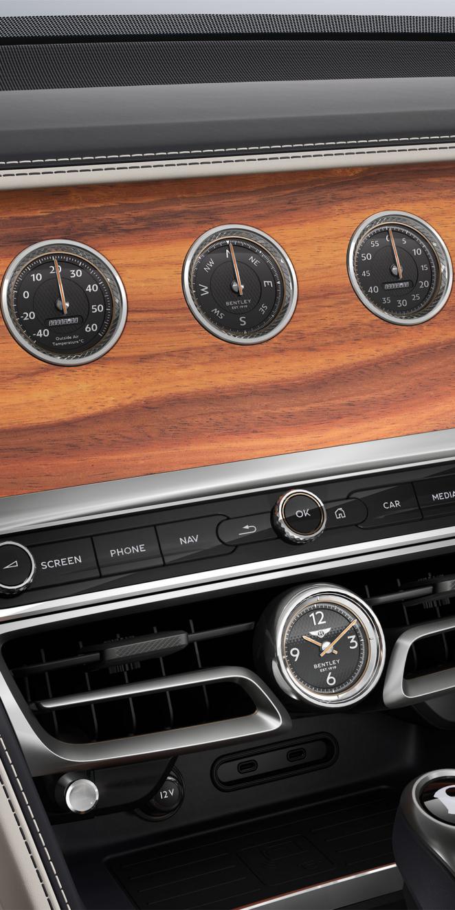 Close up shot of the Bentley Flying Spur rotating display with Open Pore Koa veneer.