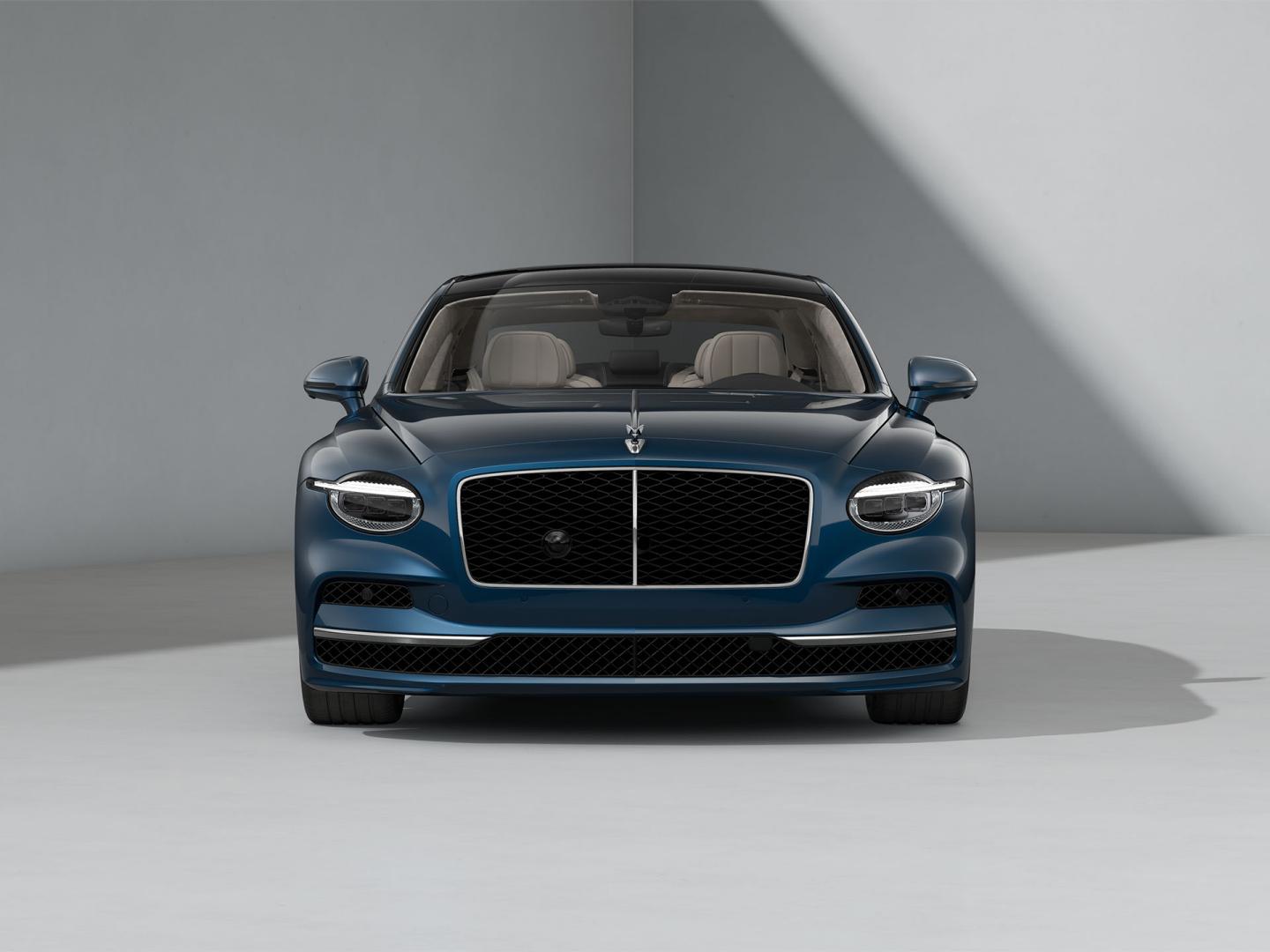 Front-on shot of the Bentley Flying Spur in Marlin with Bright Chrome Exterior detailing.