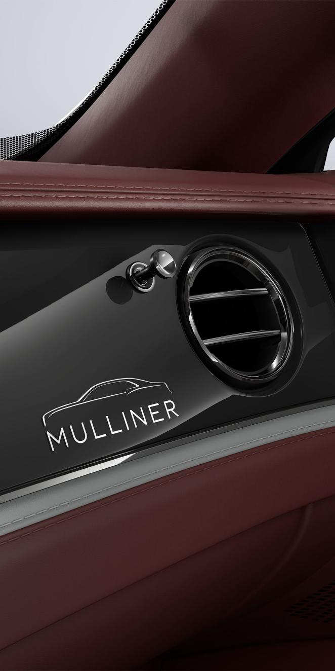 Close-up of the Grand Black / Diamond Milled Console veneer and air conditioning vent inside the Bentley Flying Spur Mulliner.