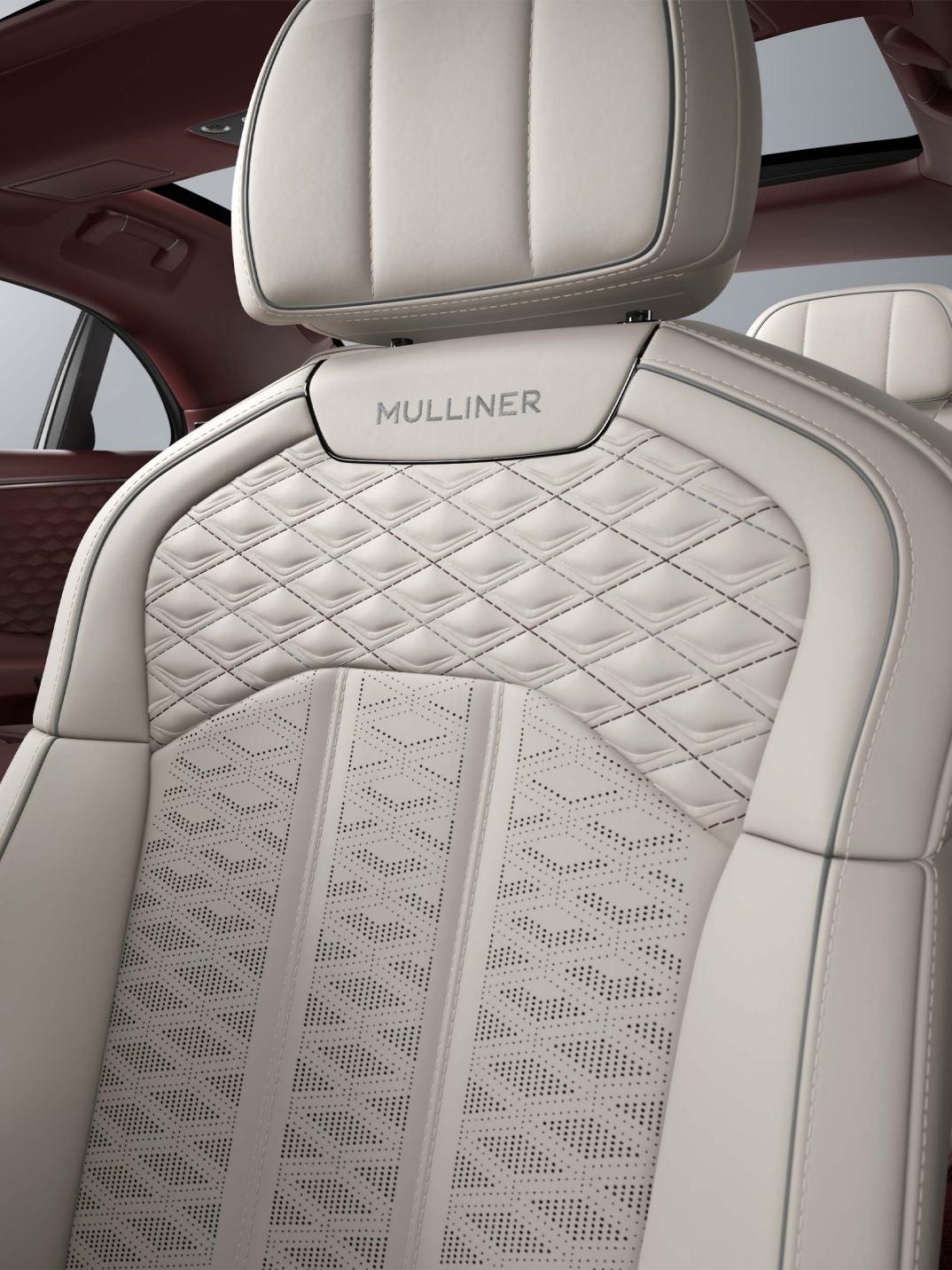 Interior view of the Bentley Flying Spur Mulliner driver’s seat in Linen, Cricket Ball and Stratos.