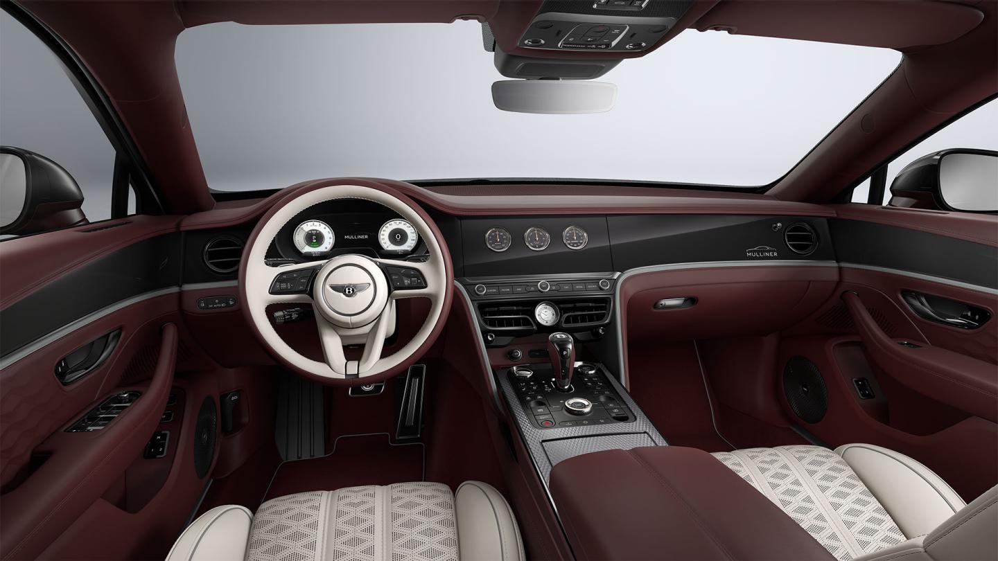Driver’s view of the Bentley Flying Spur Mulliner steering wheel with Linen, Cricket Ball and Stratos interior trim.