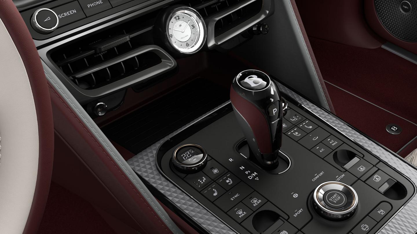 Close-up of the gear shifter inside the Bentley Flying Spur Mulliner with Linen, Cricket Ball and Stratos interior trim.