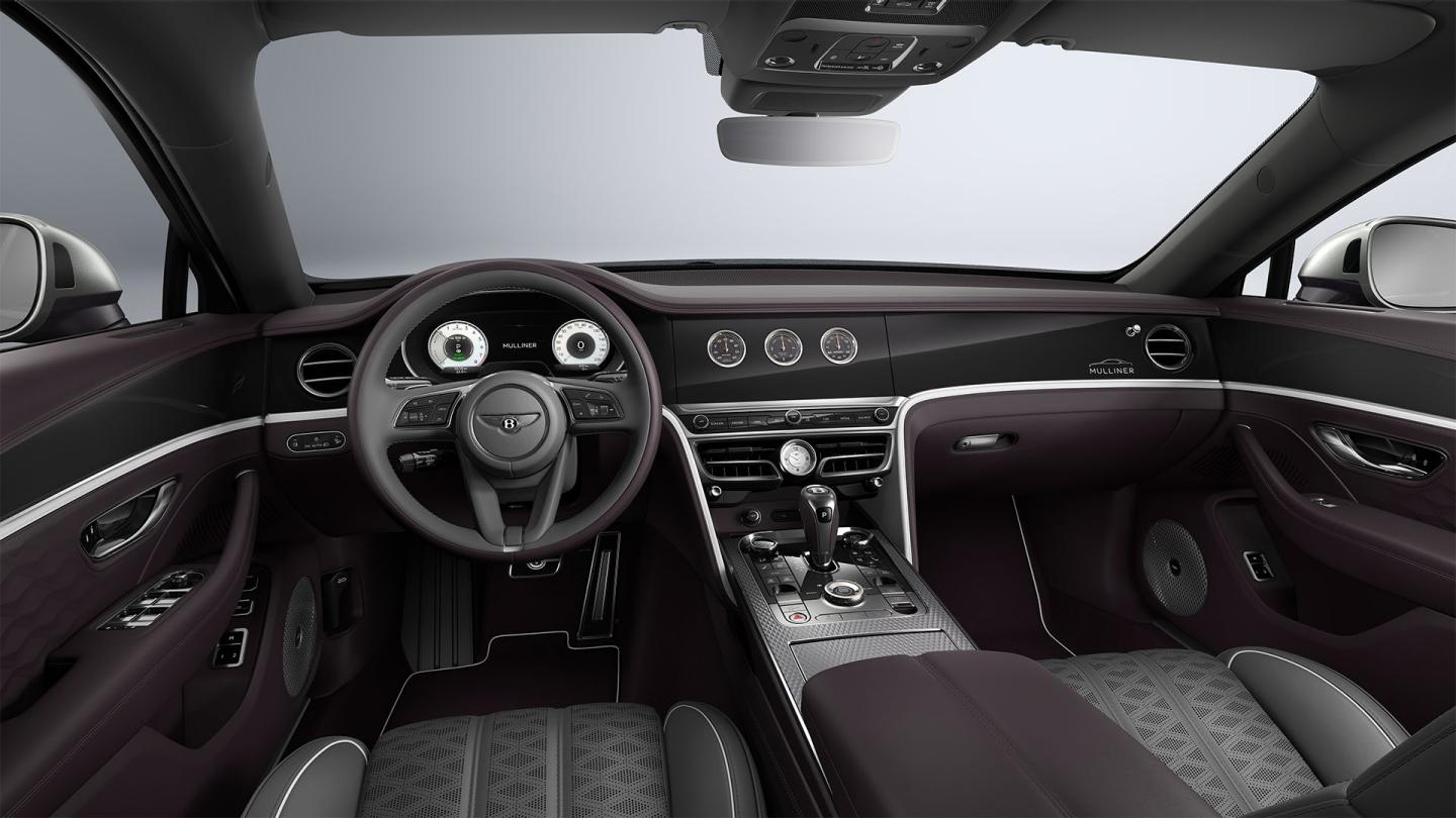 Driver’s view of the Bentley Flying Spur Mulliner steering wheel with Gravity Grey, Damson and White interior trim.