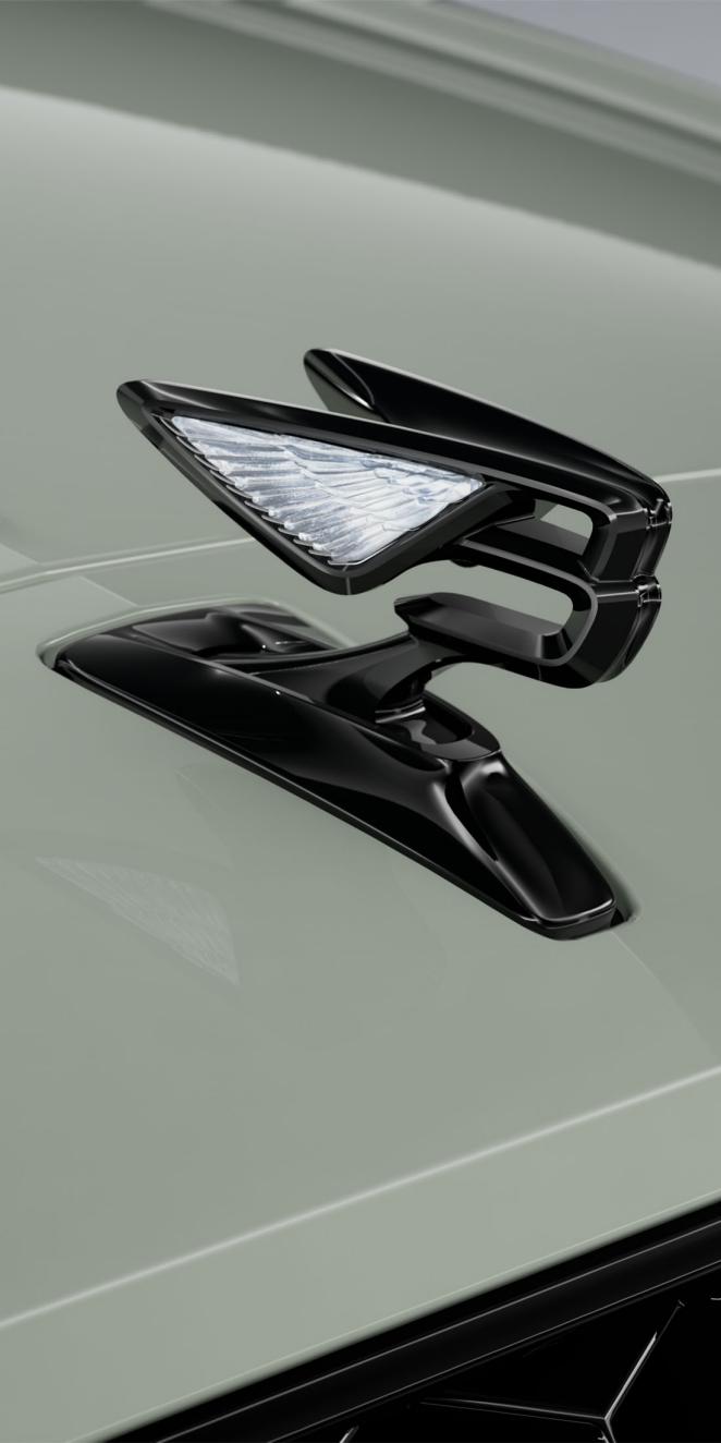 Close-up of the Flying B bonnet mascot on the Bentley Flying Spur S in Opalite.