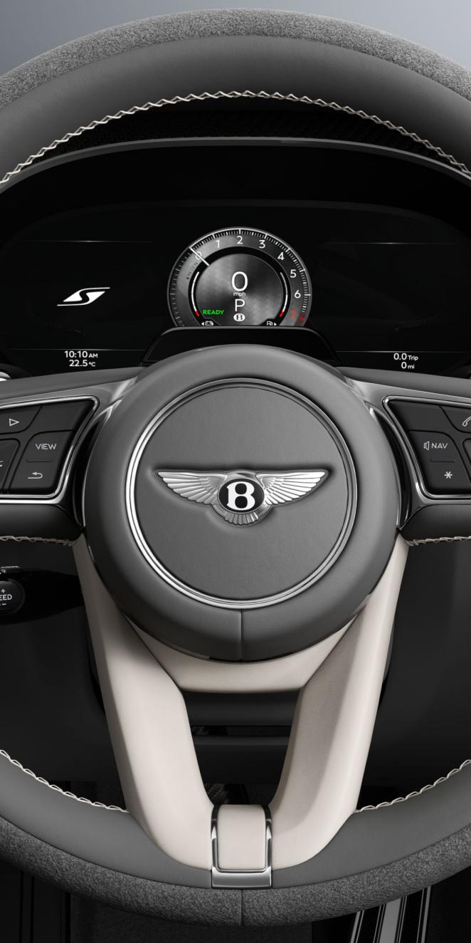 Driver’s view of the Bentley Flying Spur S steering wheel with Linen and Gravity Grey interior trim.