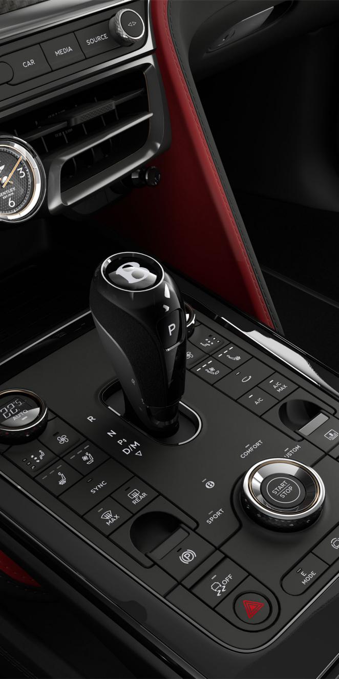 Close up of the driver controls and gear lever in the new Bentley Flying Spur Speed