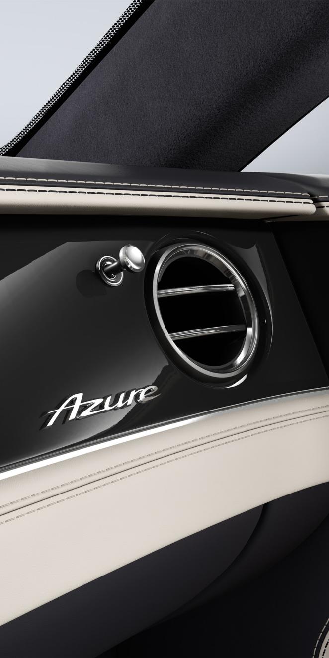 Close up of the Dark Burr Walnut veneer in the Bentley Continental GT Azure, showing the Azure badging.