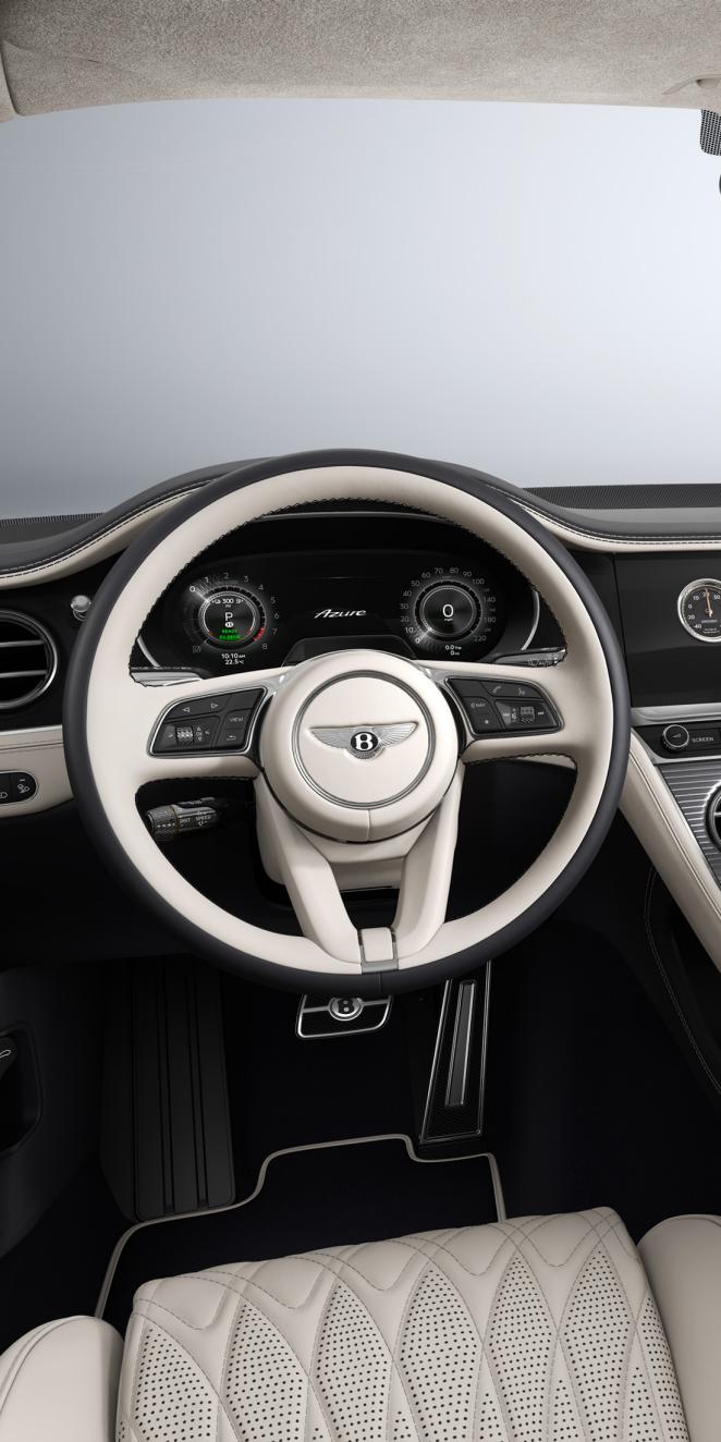 Cockpit view of the Bentley Continental GT Azure featuring Linen and Cumbrian Green hide.