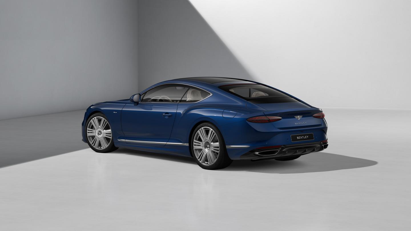 Rear three quarters shot of the Bentley Continental GT Azure in Moroccan Blue with 22" Azure Wheel painted in Silver and Bright Machined.