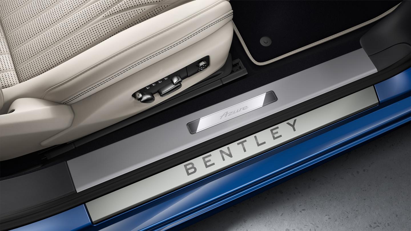 Close up of the Illuminated Treadplates in the Continental GT Azure featuring Bentley badging.