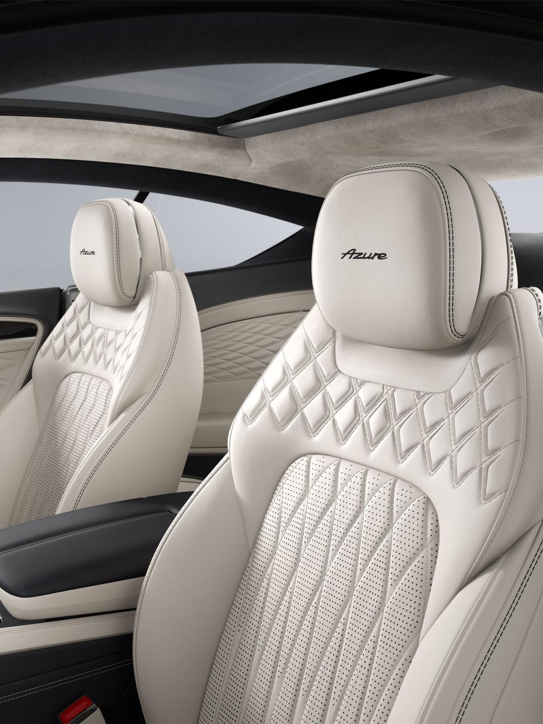 Interior view of the Bentley Continental GT Azure featuring seats upholstered in Linen and Cumbrian Green hide.