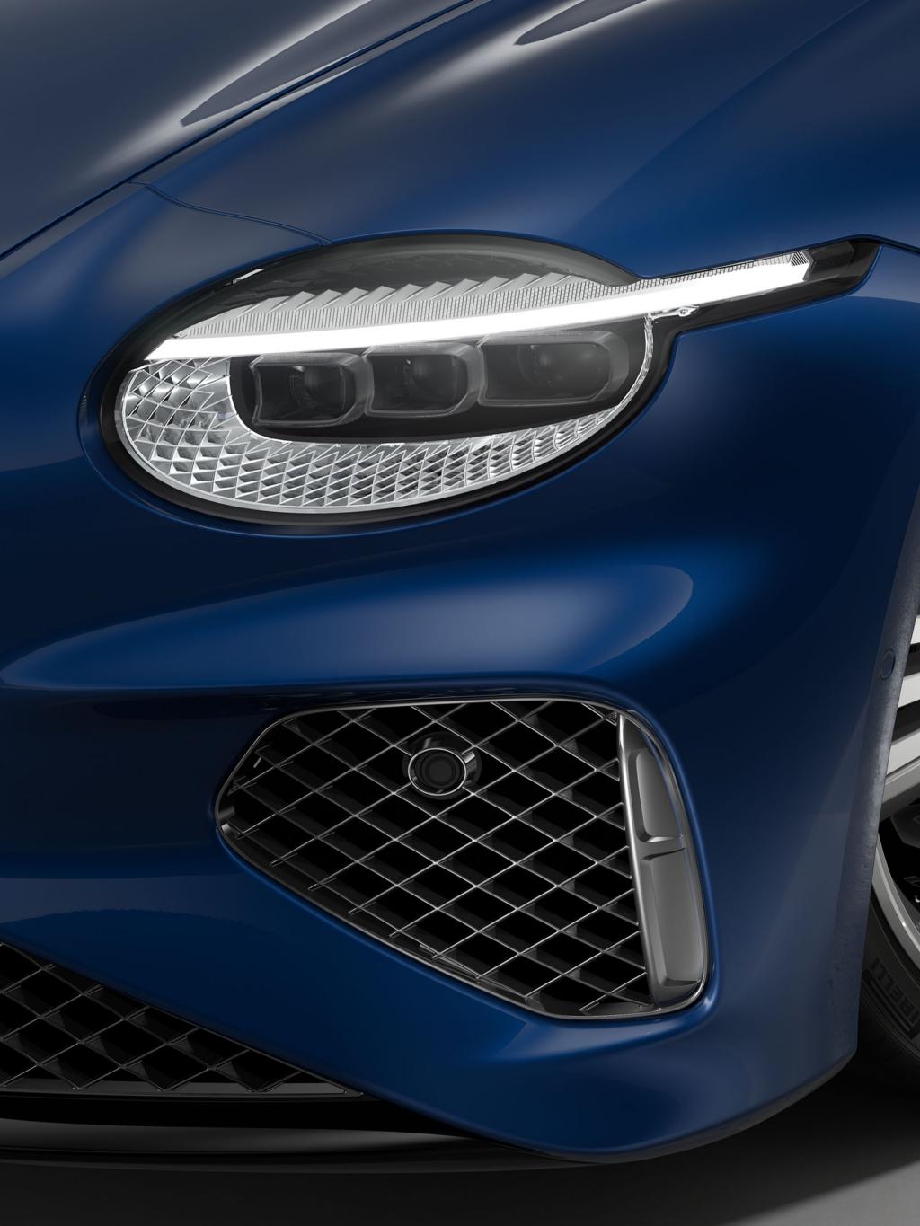 Close up of the headlights on the Bentley Continental GT Azure painted in Veridian.
