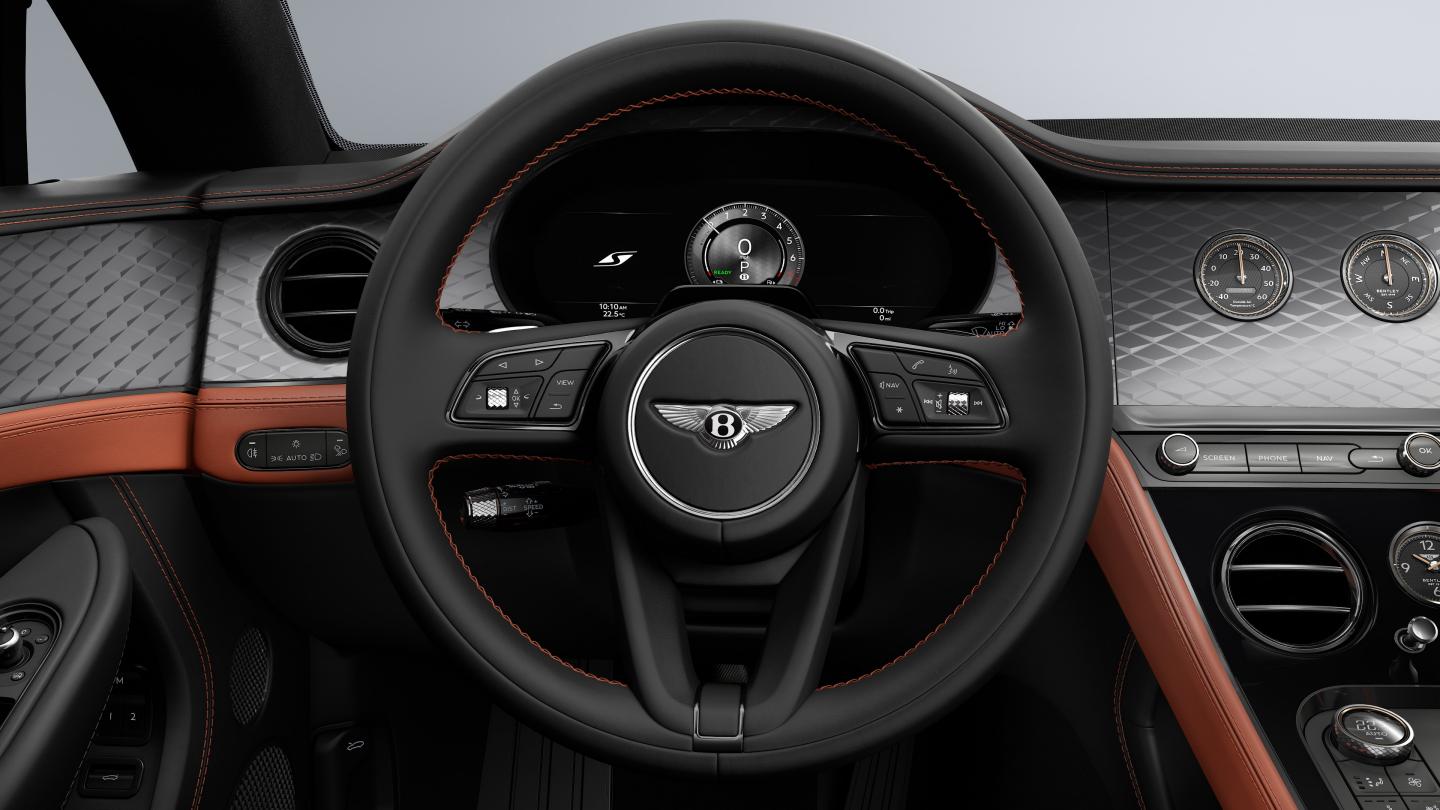 Drivers view of the steering wheel and drivers display in the new hybrid Bentley Continental GTC S