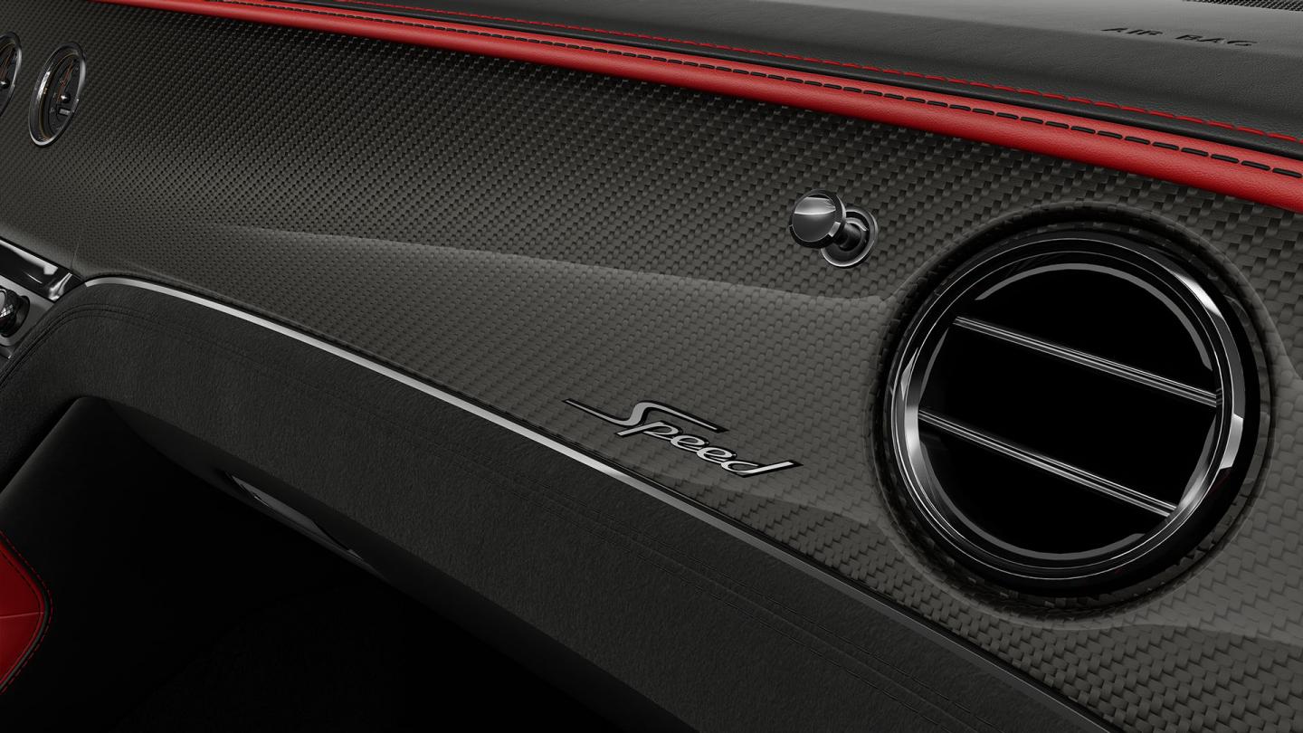 Close‑up of the Carbon Fibre veneer and Speed badging available in the Bentley Continental GT Speed.