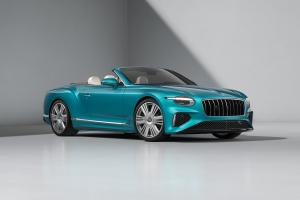 Front three quarters of the Bentley Continental GTC Azure in Topaz Blue with a Tweed convertible roof.