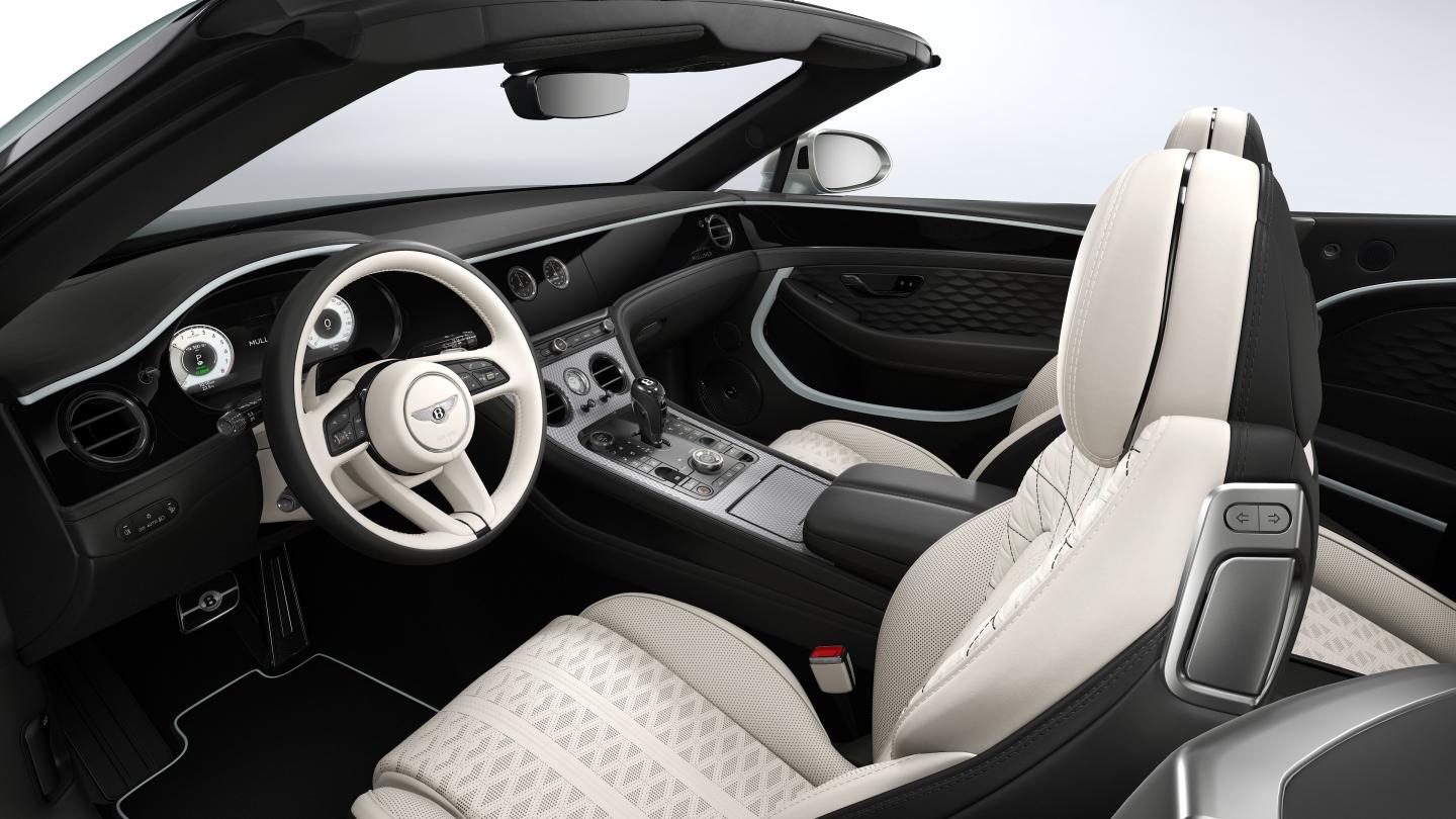 Interior view of the Bentley Continental GTC Mulliner featuring seats upholstered in Linen and Beluga hide with Breeze accent hide.