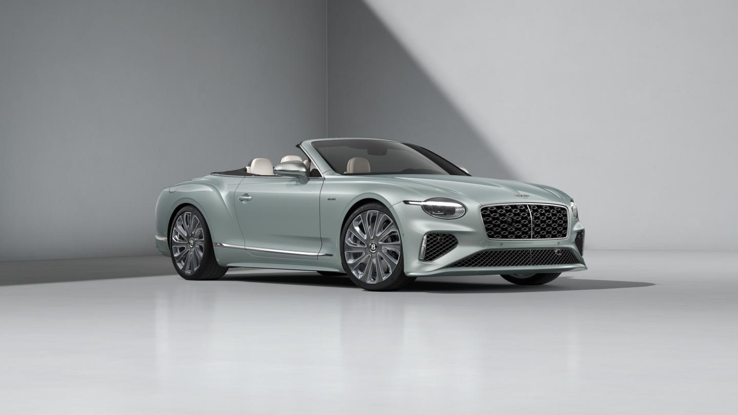 Front three quarters of the Bentley Continental GTC Mulliner in Breeze with a Grey convertible roof.