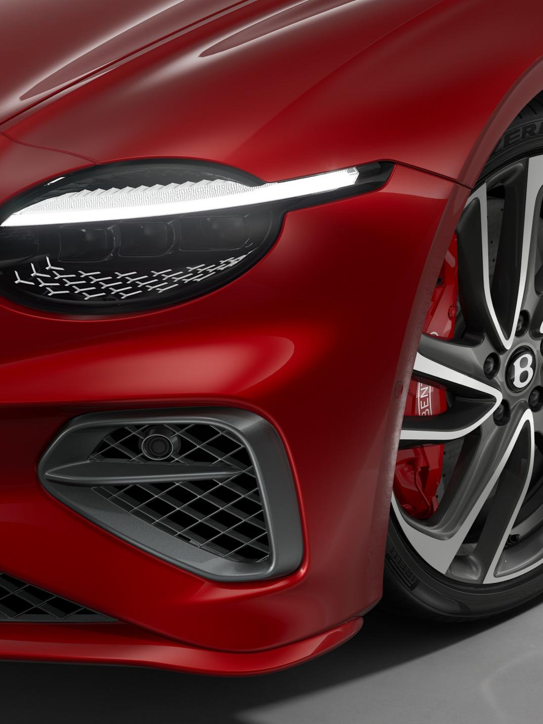 Close up of the headlights on the Bentley Continental GTC Speed in Dragon Red, shown with 22" Ten Swept Spoke Wheels in Grey and Machined.