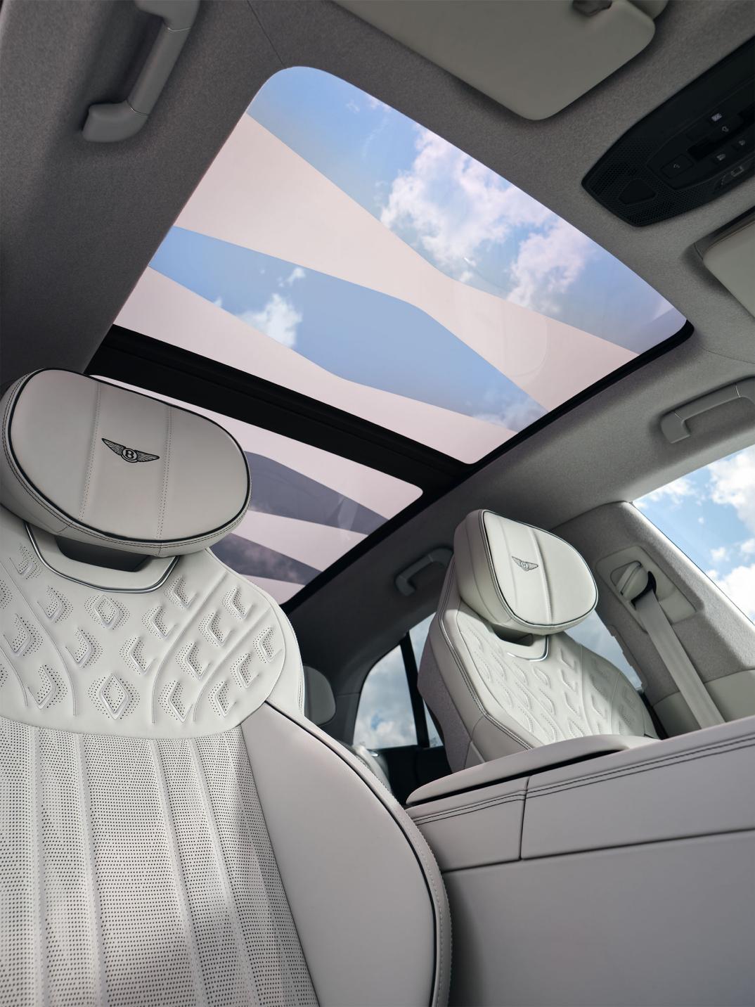 Upward view from the front seats of the Bentley Torcal showing the panoramic sunroof.