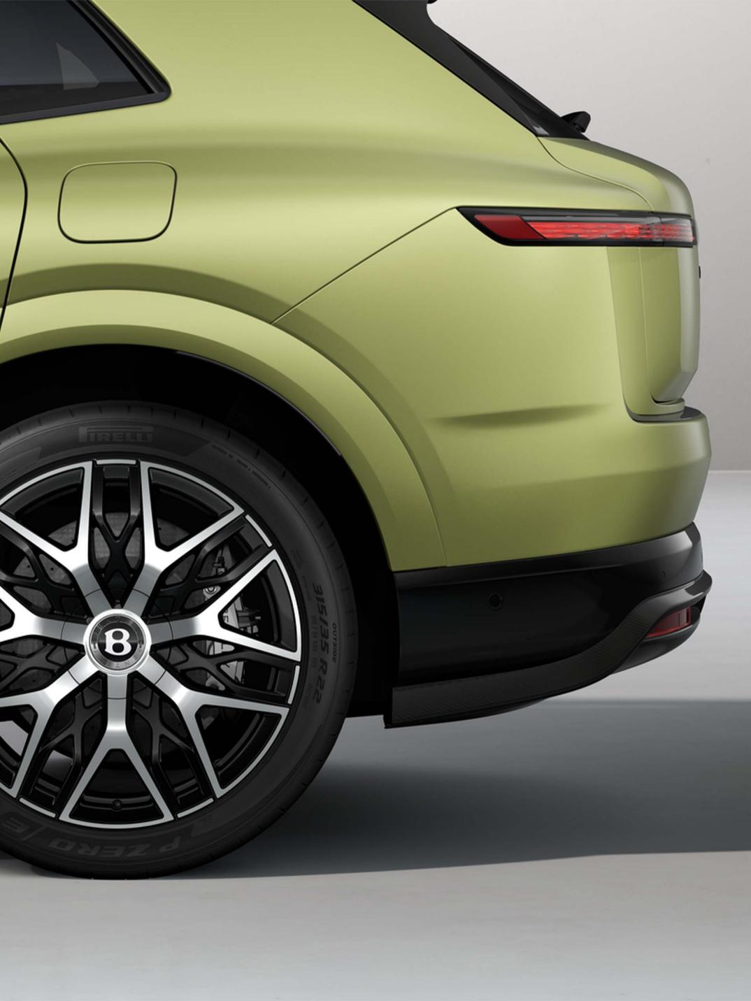 Rear three-quarter shot of the Bentley Torcal S in Electrum Satin.
