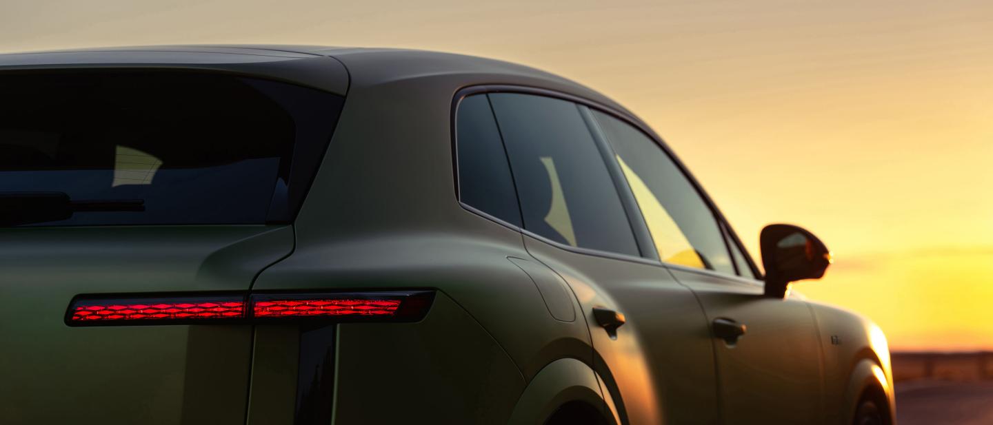 Rear three-quarter close-up of the Bentley Torcal S in Electrum Satin showing the rear lights and tailgate.