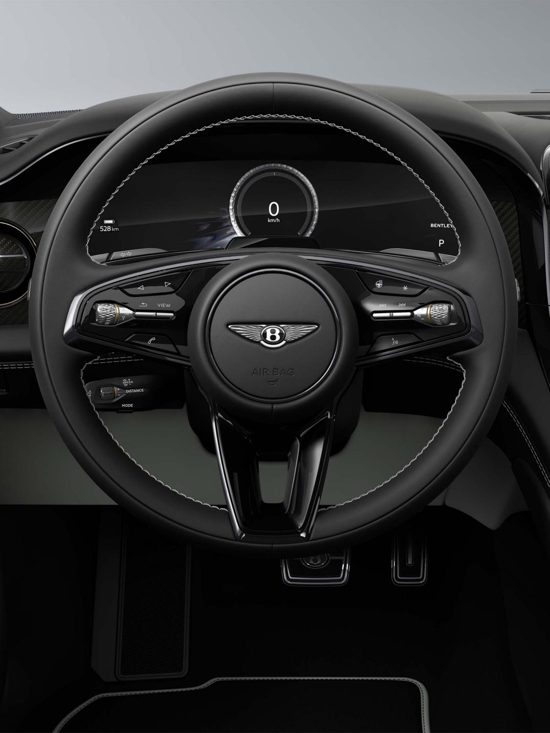 Driver’s view of the Bentley Torcal S steering wheel, digital displays and Glaze and Beluga interior.