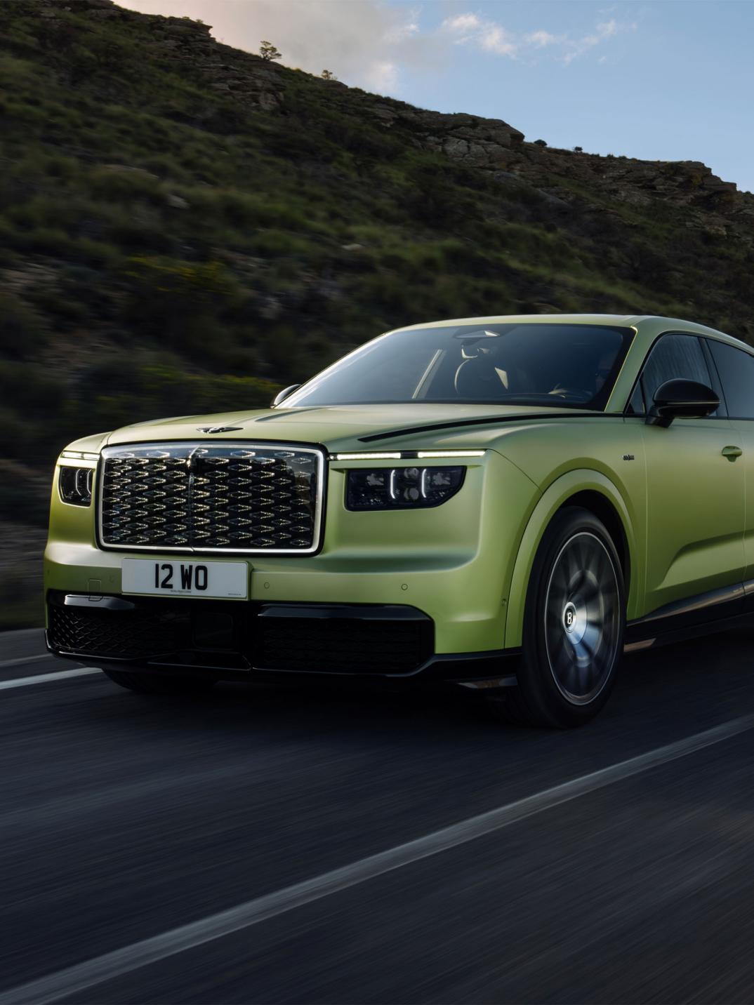 Front three-quarter driving shot of the Bentley Torcal S in Electrum Satin.