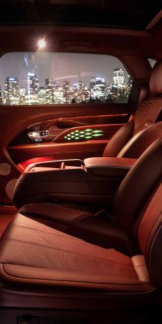 Bentley Bentayga EWB Mulliner, rear passenger seat view overlooking arm rest and door, featuring multicoloured diamond illumination.