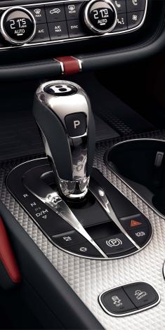 Bentley Bentayga EWB Mulliner, featuring patterned aluminium central console and gear shift knob with Bentley logo.