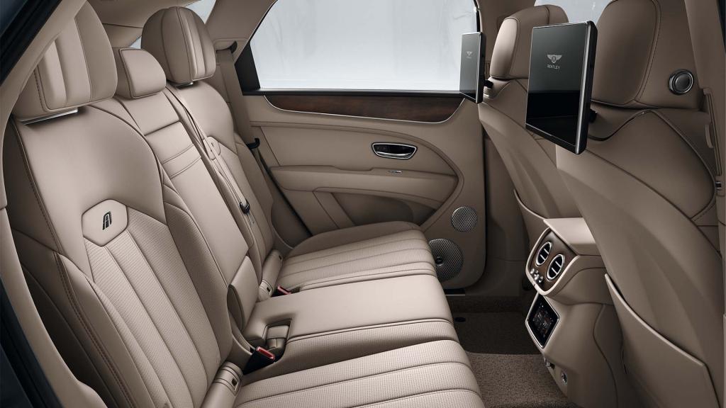 Bentey Bentayga A interior view for rear passengers with Portland hide and Rear Seat Entertainment featuring 'A' Emblems in contrast stitch.