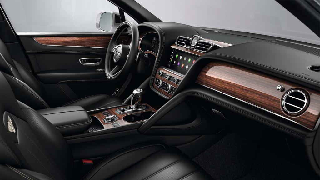Bentley Bentayga interior with a Crown Cut Walnut veneer, view from the passenger seat over looking the driver's seat.