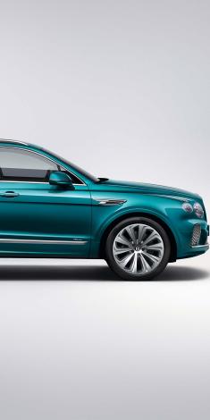 Bentyley Bentayga Azure V8, front side quarter view in Topaz Blue colour featuring 22" 10 spoke alloy wheel – painted and Flying B wing vent