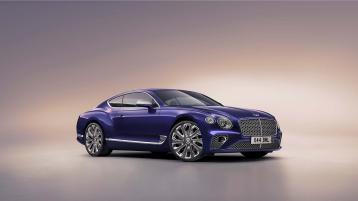 Side view of Bentley Continental GT Mulliner in Tanzanite Purple colour featuring 22 inch Mulliner Wheel Painted and Polished with Bright wing vent. 