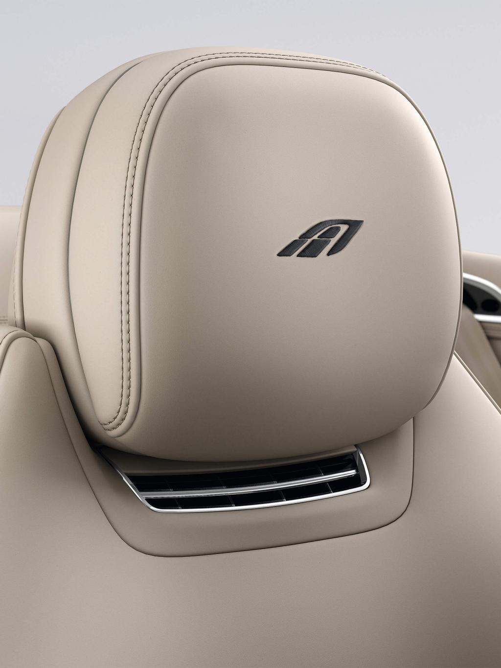 "Close up on Bentley Continental GTC A V8 seat in Portland Hide featuring A Emblem in Contrast Stitching. "