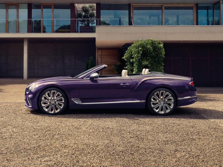 Bentley Continental GTC Mulliner side view in Tanzanite Purple featuring chrome accents and 22" Mulliner Wheel Painted and Polished, roof down.