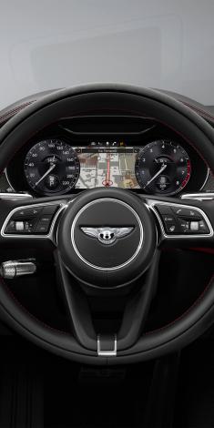 Closeup view of Bentley Continental GTC S heated, single tone, 3 spoke Steering Wheel set in Beluga hide.