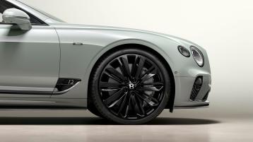 Bentley Continental GTC Speed Edition 12 front side quarter view in Glacier White colour featuring 22" Speed alloy wheel – black painted.