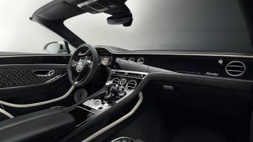 Passenger side view of Bentley Continental GTC Speed Edition 12 overlooking driver side with Beluga hide and Grand black veneer. 