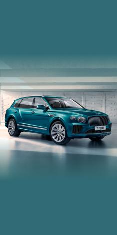 Bentley Bentayga EWB Azure in Topaz Blue colour side angled view featuring 22 inch Ten Spoke Wheels and fluted chrome grille with a matrix lower grille.