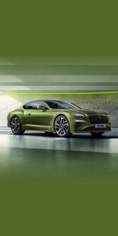 Front side angled view of Bentley Continental GT Speed in Tourmaline Green exterior colour, featuring 22 inch Speed Wheel - Dark Tint and Black gloss radiator matrix grille with black surround.