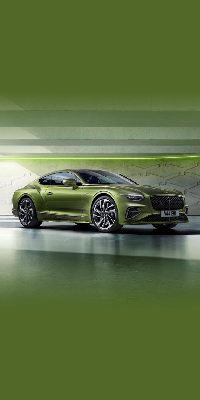 Front side angled view of Bentley Continental GT Speed in Tourmaline Green exterior colour, featuring 22 inch Speed Wheel - Dark Tint and Black gloss radiator matrix grille with black surround.