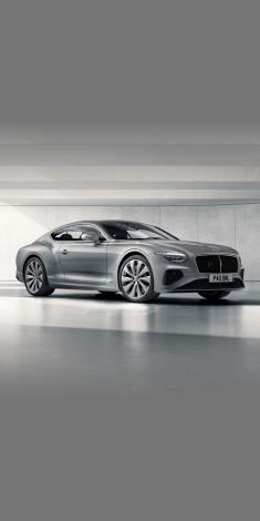 Front side angled view of Bentley Continental GT Mulliner W 12 in Tanzanite purple colour, featuring 22 inch Mulliner Wheel Painted and Mulliner double diamond radiator grille - Black