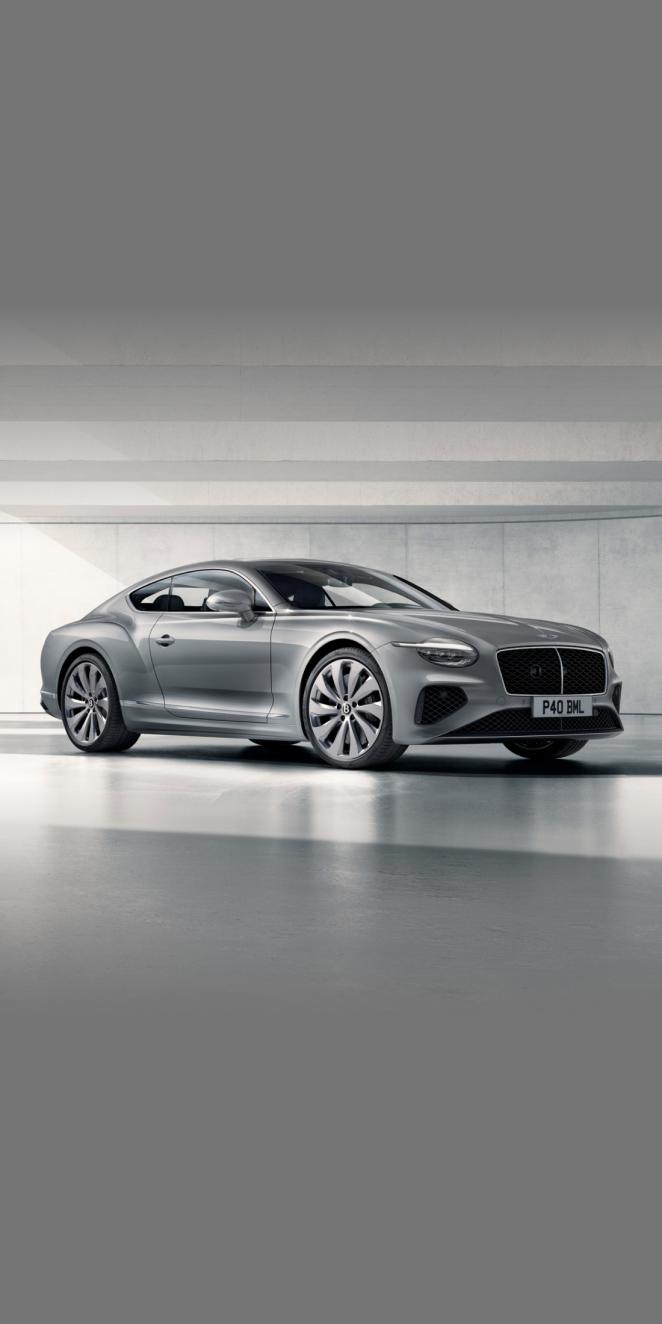 Front side angled view of Bentley Continental GT Mulliner W 12 in Tanzanite purple colour, featuring 22 inch Mulliner Wheel Painted and Mulliner double diamond radiator grille - Black