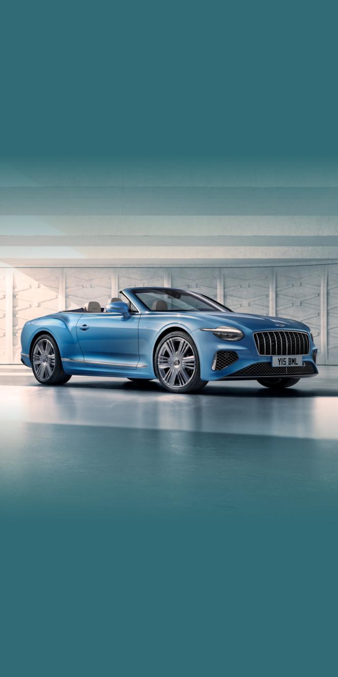 Front side angled view of Bentley Continental GTC Azure V8 in Topaz Blue -by Mulliner, featuring 22 inch Ten Spoke Wheel-Black Painted and Bright Machined.
