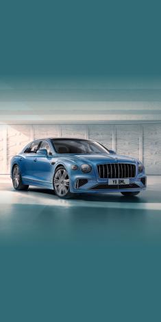 Front side angled view of Bentley Flying Spur Azure in Light Windsor Blue colour, featuring 22 inch Ten Spoke Wheel - Chrome radiator mascot