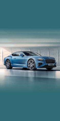 Front side angled view of Bentley Continental GT Azure V8 in Topaz Blue -by Mulliner, featuring 22 inch Ten Spoke Wheel-Black Painted and Bright Machined.